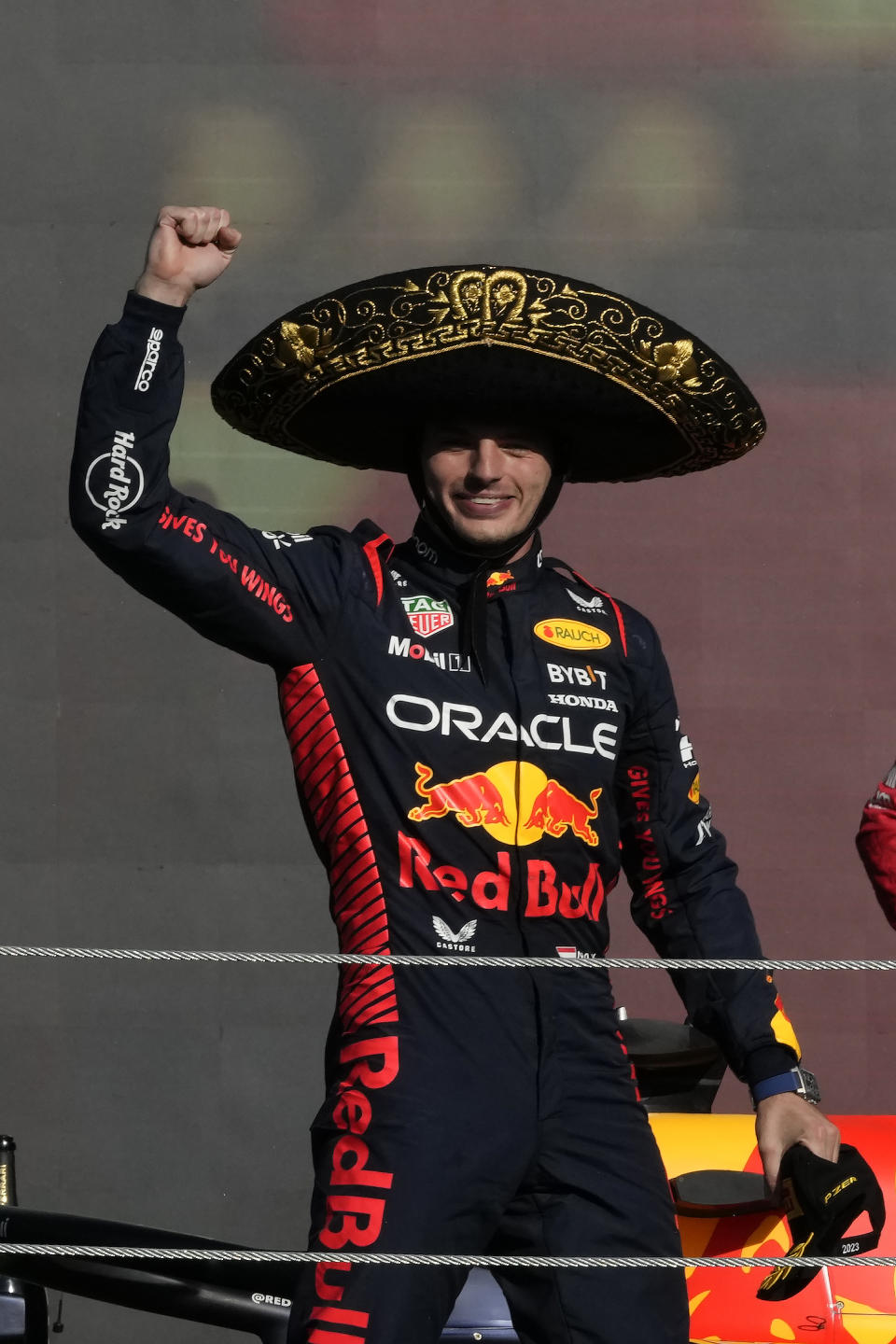 Red Bull driver Max Verstappen of the Netherlands celebrates on the podium after winning the Formula One Mexico Grand Prix auto race at the Hermanos Rodriguez racetrack in Mexico City, Sunday, Oct. 29, 2023. (AP Photo/Fernando Llano)
