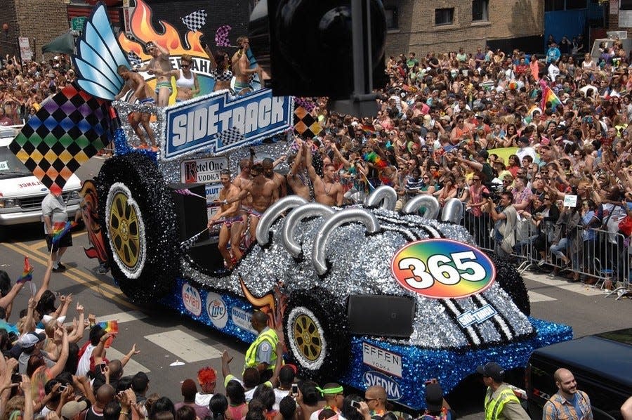 Chicago’s largest gay bar sponsors the Sidetrack float during a Pride parade. The bar is a fixture in the gay community.