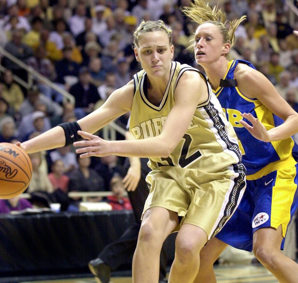 Purdue's Katie Douglas drives on UC Santa Barbara's Rachelle Rogers in the first half of their NCAA Women's Basketball Mideast Regional game at Mackey Arena in West Lafayette in 2001.