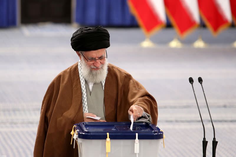 Iran's Supreme Leader Ayatollah Ali Khamenei casts his vote at a polling station during parliamentary elections in Tehran