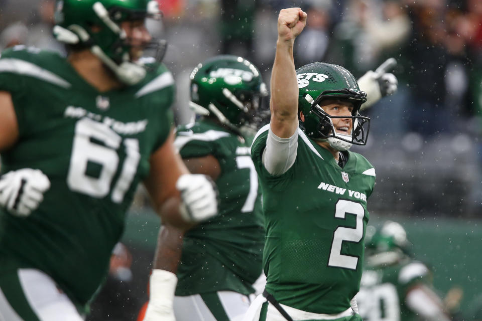 FILE - New York Jets quarterback Zach Wilson (2) celebrates after a touchdown against the Houston Texans during the second half of an NFL football game, Sunday, Dec. 10, 2023, in East Rutherford, N.J. Teams are using premium draft picks on quarterbacks at an increasingly high rate. Still, the league-wide hit rate remains largely a tossup.(AP Photo/John Munson, File)