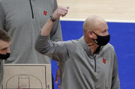 Louisville coach Chris Mack gestures as he talks to the team during a timeout in the second half of the team's NCAA college basketball game against Pittsburgh, Tuesday, Dec. 22, 2020, in Pittsburgh. (AP Photo/Keith Srakocic)