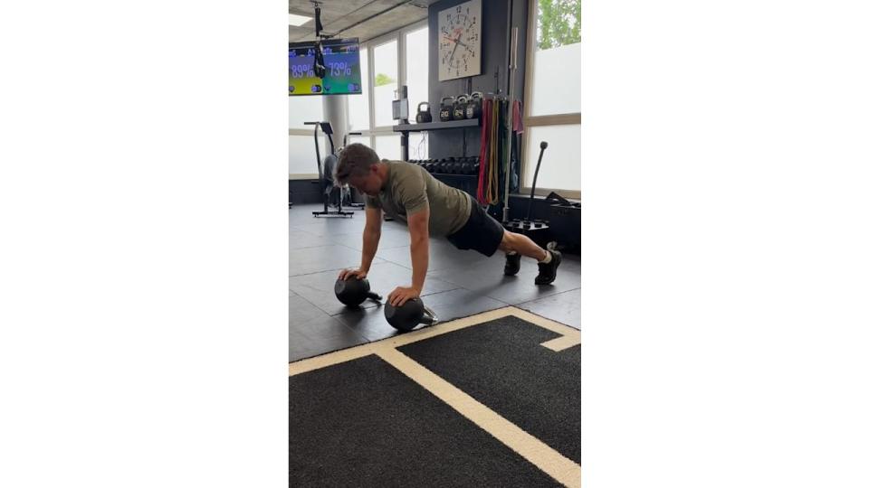 Ben Shephard performing push-ups on a pair of kettlebells