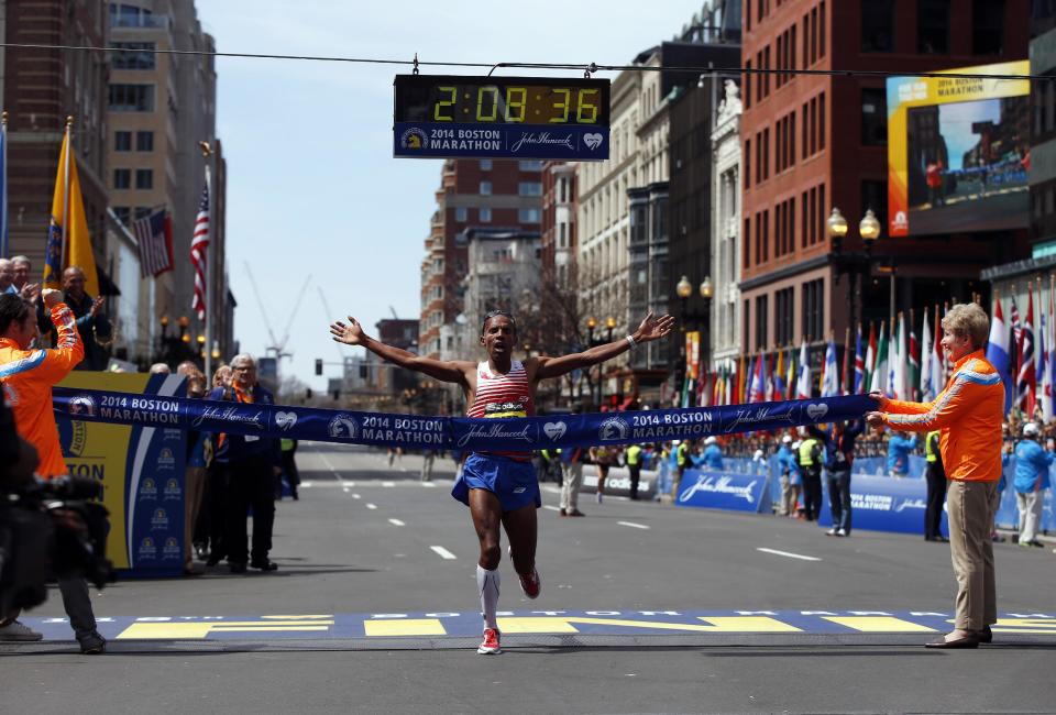 Meb Keflezighi, of San Diego, Calif., crosses the finish line of the 118th Boston Marathon, Monday, April 21, 2014, in Boston. (AP Photo/Elise Amendola)