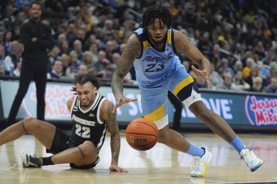 Marquette's David Joplin and Providence's Devin Carter go after a loose ball during the first half of an NCAA college basketball game Wednesday, Feb. 28, 2024, in Milwaukee. (AP Photo/Morry Gash)