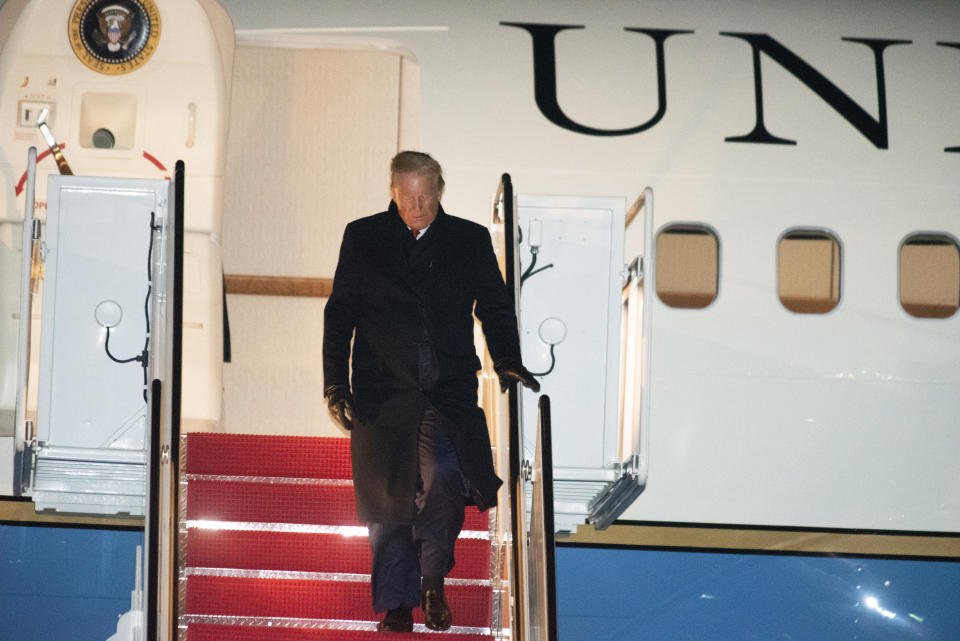 President Donald Trump exits Air Force One on Wednesday, Dec. 18, 2019, at Andrews Air Force Base, Md., following a campaign trip to Battle Creek, Mich. (AP Photo/Kevin Wolf)