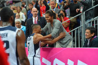 Russell Westbrook #7 of the USA Mens Senior National team hugs The First Lady Michelle Obama after defeating France 98-71 at the Olympic Park Basketball Arena during the London Olympic Games on July 29, 2012 in London, England. NOTE TO USER: User expressly acknowledges and agrees that, by downloading and/or using this Photograph, user is consenting to the terms and conditions of the Getty Images License Agreement. Mandatory Copyright Notice: Copyright 2012 NBAE (Photo by Jesse D. Garrabrant/NBAE via Getty Images)