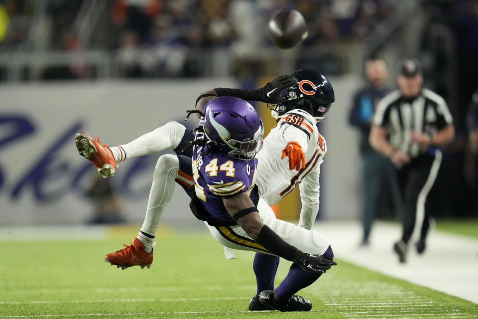 Minnesota Vikings safety Josh Metellus (44) breaks up a pass intended for Chicago Bears wide receiver Darnell Mooney during the first half of an NFL football game, Monday, Nov. 27, 2023, in Minneapolis. (AP Photo/Abbie Parr)