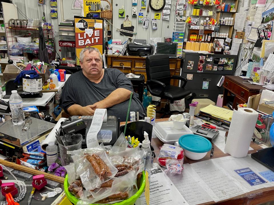 Kenneth "Poor Boy" Williams, eats lunch at his store in Magoffin County, Kentucky.