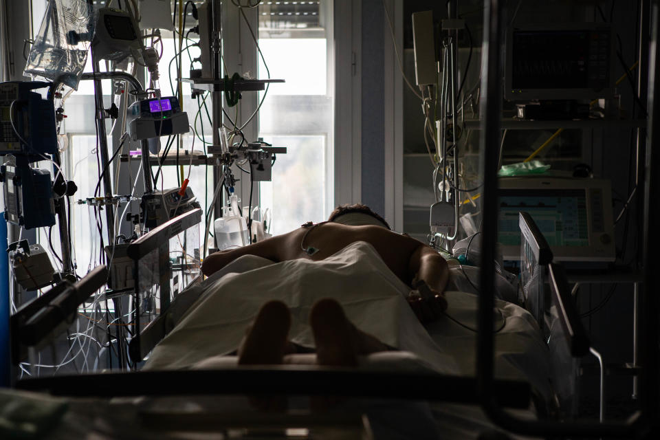 A patient lies in the intensive care unit at the Cremona Hospital in Northern Italy. | Arianna Pagani