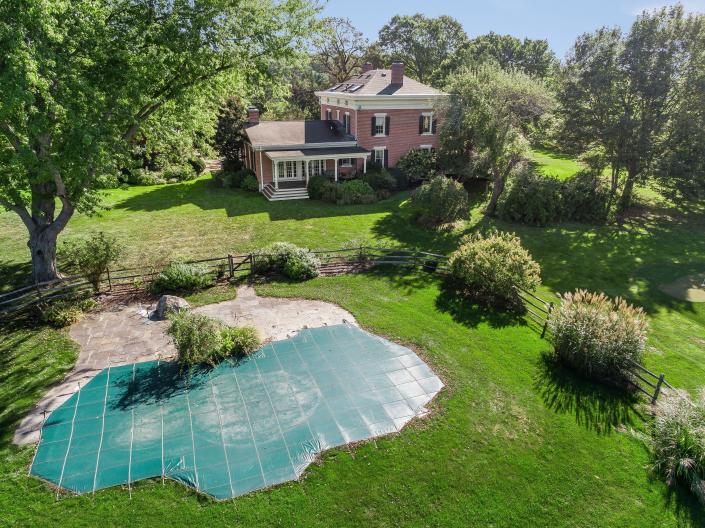 The property includes a pool, putting green and gardens.