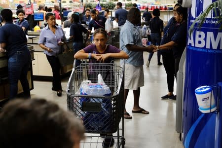 Shoppers at a local supermarket are seen before the arrival of Hurricane Dorian on the Great Abaco island town of Marsh Harbour