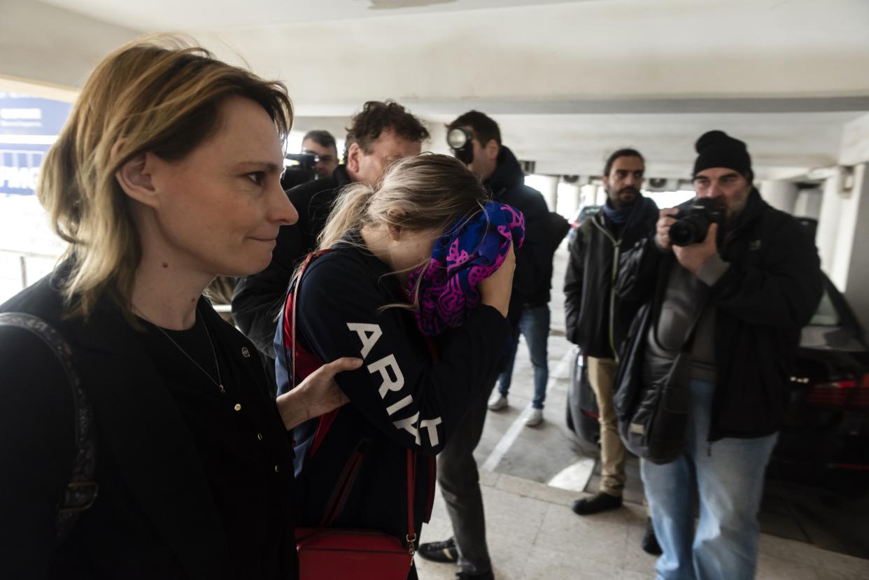 A British teenager accused of falsely claiming she was raped by Israeli tourists, covers her face as she arrives for her trial at the Famagusta District Court in Paralimni in eastern Cyprus, on December 30, 2019. - The Briton who had alleged 12 Israeli tourists gang raped her on July 17, at a hotel in the eastern resort of Ayia Napa, has been found guilty of lying by a Cypriot court, her sentencing adjourned until January 7. (Photo by Iakovos Hatzistavrou / AFP) (Photo by IAKOVOS HATZISTAVROU/AFP via Getty Images)