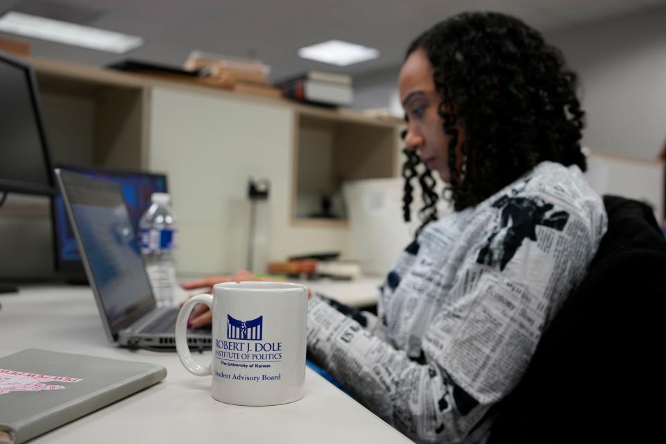 USA TODAY White House reporter Francesca Chambers writes about the midterm elections in the DC bureau. Chambers uses a vintage Robert Dole Institute of Politics coffee cup.