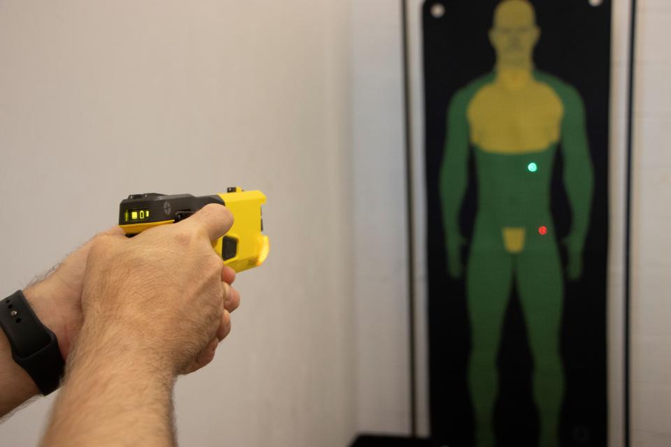 A security officer at NCH practices use of a taser in events of patients acting out.