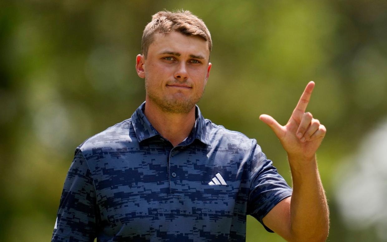 Ludvig Aberg, of Sweden, waves after making a putt on the fifth hole during the first round of the U.S. Open golf