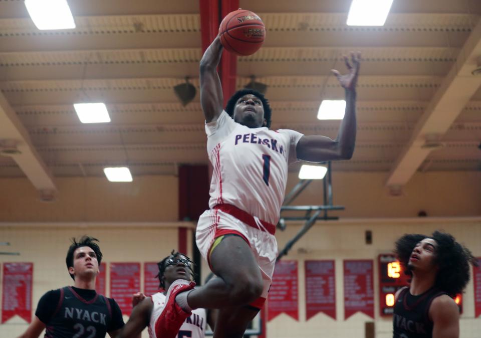Peekskill's Amir Thames (1) on his way to the basket for a first half dunk against Nyack during basketball action at Peekskill High School Jan. 24, 2024.