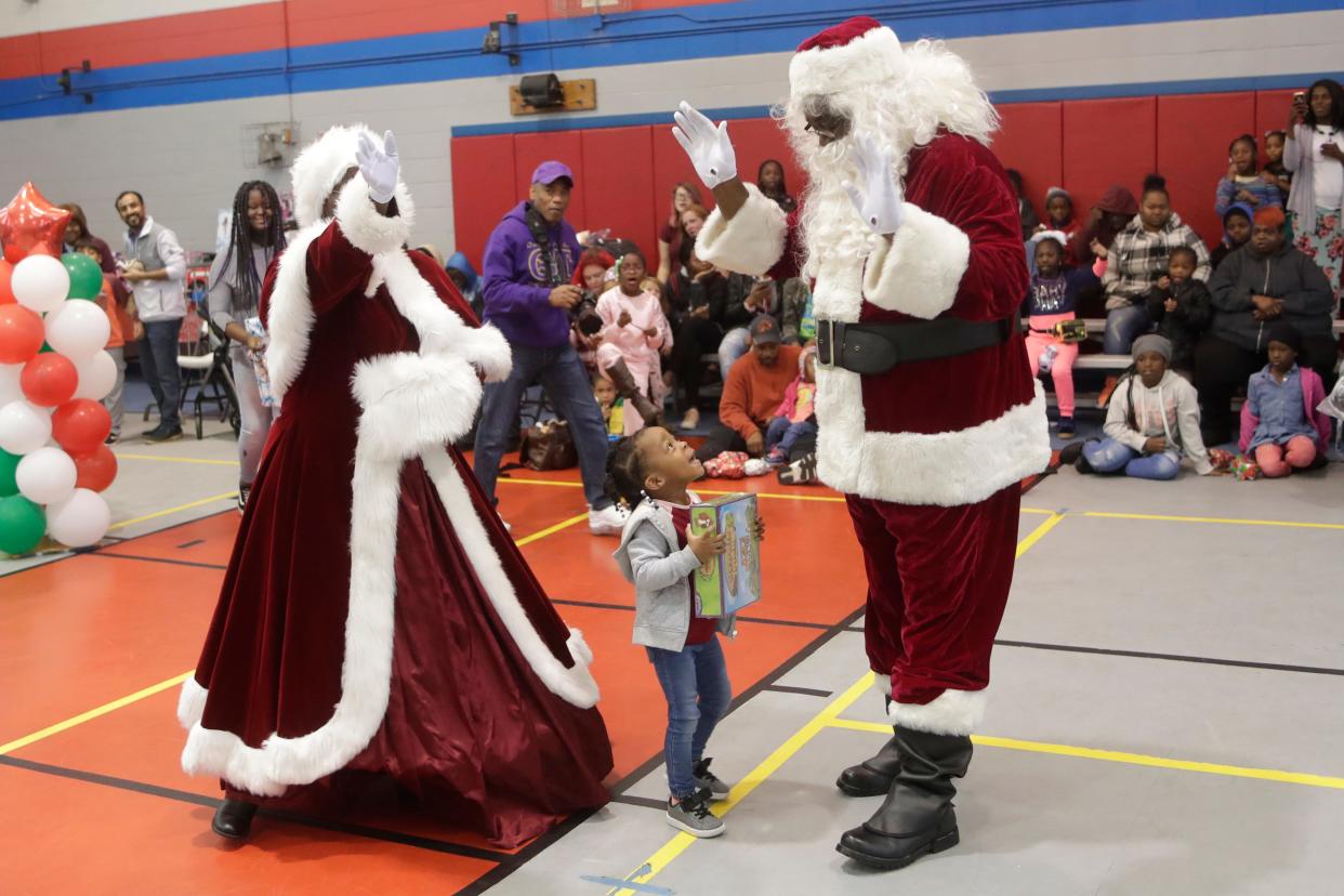 Soul Santa and Mrs. Claus arrive to Walker-Ford Community Center for their annual visit Saturday, Dec. 21, 2019.