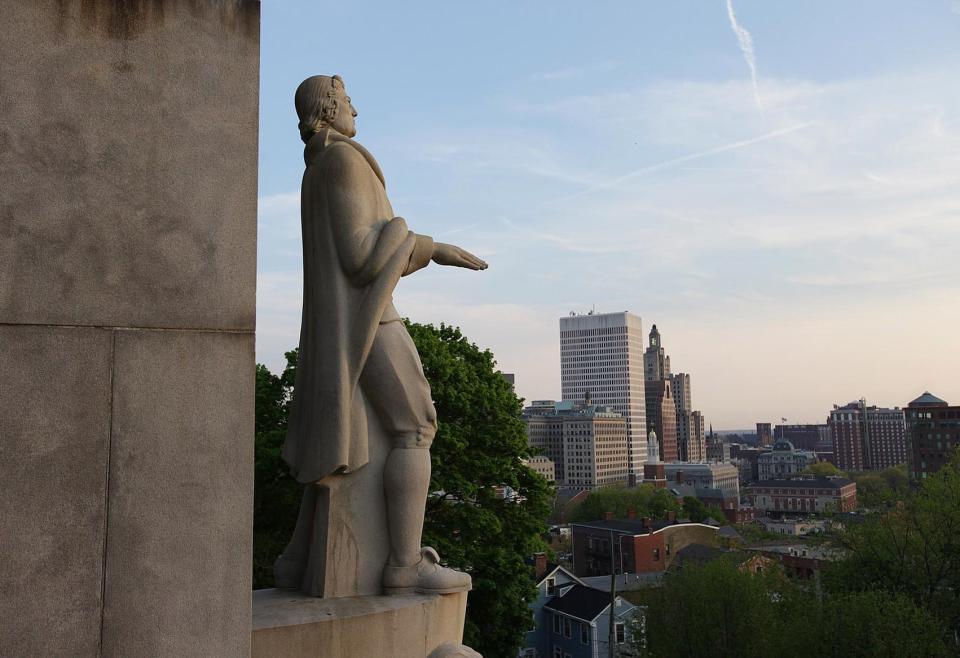 A statue of Rhode Island founder Roger Williams overlooks Providence from Prospect Terrace Park.