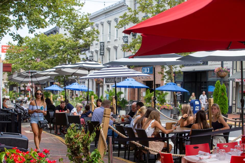 Diners and pedestrians, shown in 2021, enjoy the pedestrian only walkway section of Broad Street in between White Street and West Front Street in Red Bank.