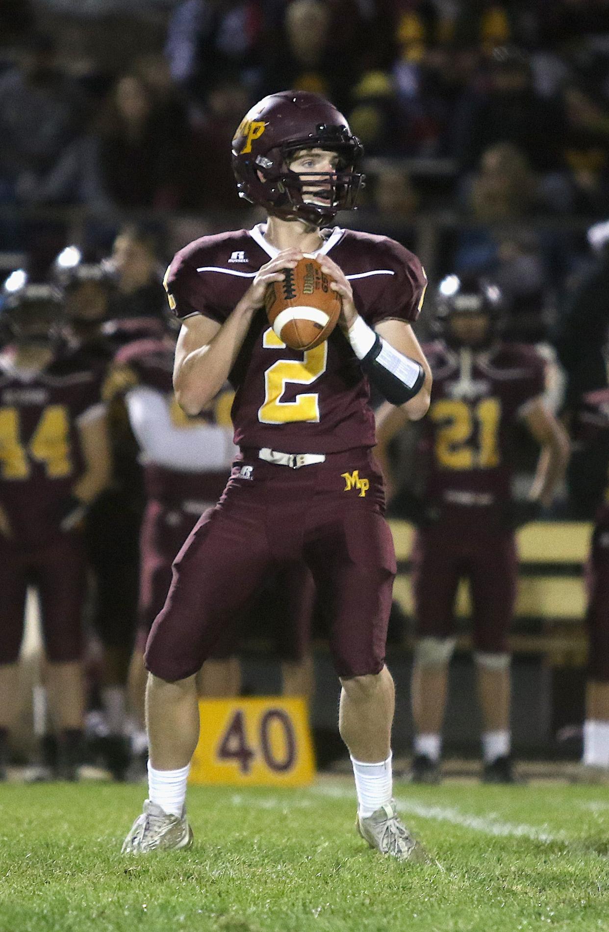 Mount Pleasant’s Jacob Richtman (2) looks to pass against Burlington Friday in Mount Pleasant.