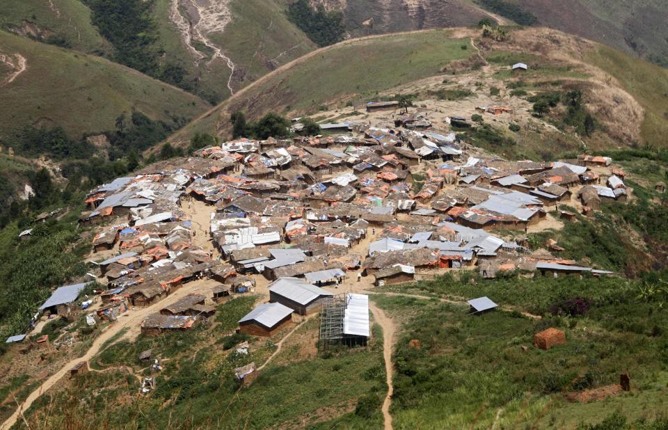 A general view shows a village near the Marco gold mine in Mukungwe locality in Walungu territory of South Kivu May 9, 2014. Decades of corruption, mismanagement and violence have blighted the development of Congo, which at the time of independence in 1960 was Africa's second most industrialised economy. In 2013 it was near the foot of global tables for per capita economic output. Now industrial mining operations are moving back to regions that have been the preserve of artisanal miners since the collapse of Congo's state-run mining operations in the 1990s, at the end of dictator Mobutu Sese Seko's 31-year rule. Picture taken May 9, 2014. REUTERS/Kenny Katombe (DEMOCRATIC REPUBLIC OF CONGO - Tags: BUSINESS COMMODITIES INDUSTRIAL EMPLOYMENT CIVIL UNREST POLITICS)