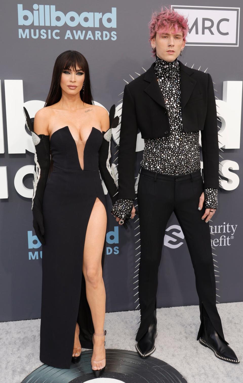 MGK and Megan Fox pose on red carpet (Getty Images)