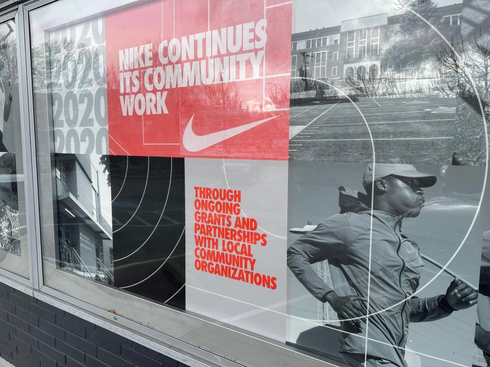 Signs outside a Nike store in Portland, Oregon, describes the company's work in the surrounding community.