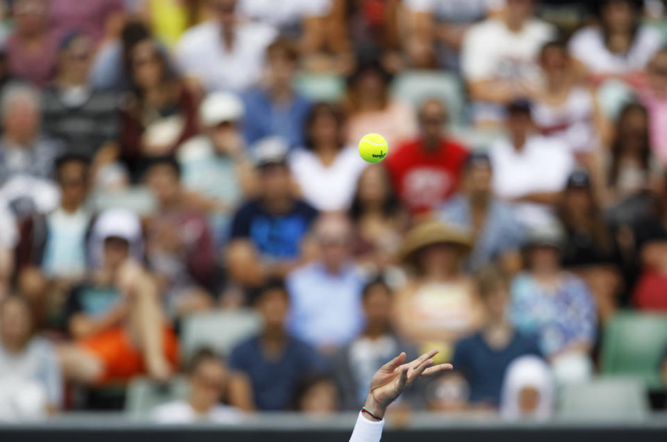 Nicolas Almagro of Spain serves to Steve Johnson of the U.S. during their men's singles match at the Australian Open tennis tournament in Melbourne, January 14, 2013. REUTERS/Navesh Chitrakar (AUSTRALIA - Tags: SPORT TENNIS TPX IMAGES OF THE DAY) 