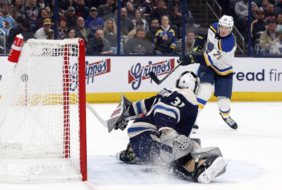 St. Louis Blues forward Sammy Blais, right, scores past Columbus Blue Jackets goalie Michael Hutchinson during the first period of an NHL hockey game in Columbus, Ohio, Saturday, March 11, 2023. (AP Photo/Paul Vernon)