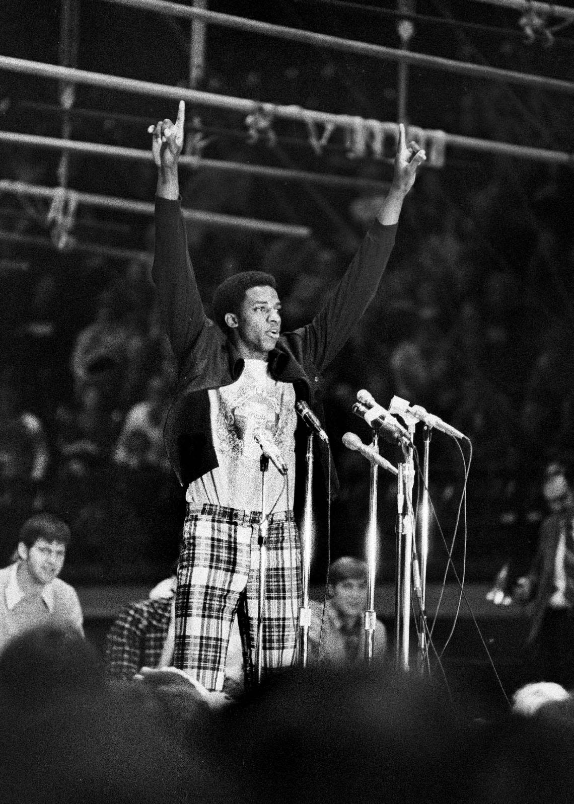 David Thompson salutes the crowd in Reynolds Coliseum after the Wolfpack returned from Greensboro where the defeated Marquette to win the 1974 NCAA basketball championship.