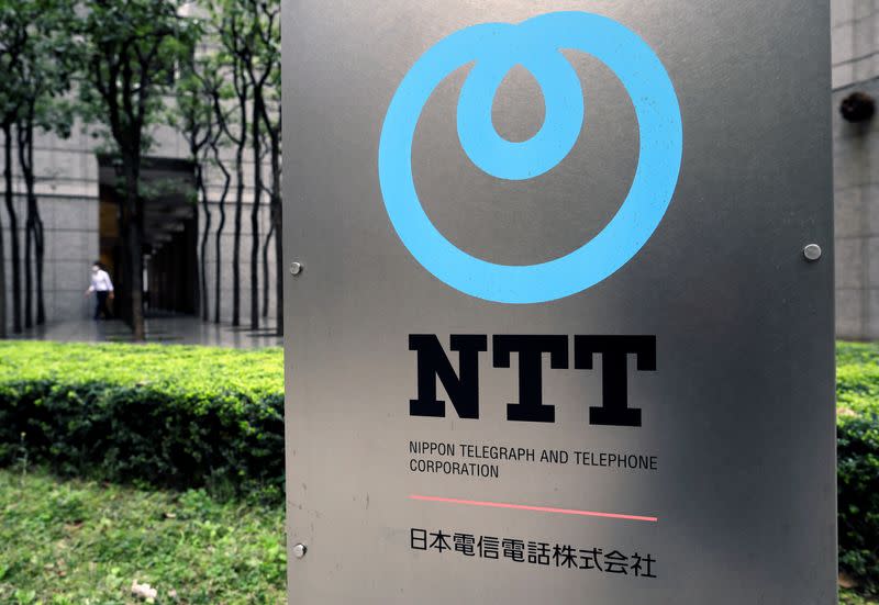 The logo of NTT (Nippon Telegraph and Telephone Corporation) is displayed at the company office in Tokyo