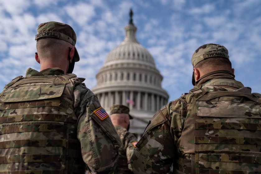 WASHINGTON, DC - JANUARY 17: Members of the National Guard in the plaza in front of the U.S. Capitol Building on Sunday, Jan. 17, 2021 in Washington, DC. After last week's riots and security breach at the U.S. Capitol Building, the FBI has warned of additional threats in the nation's capital and across all 50 states. (Kent Nishimura / Los Angeles Times)