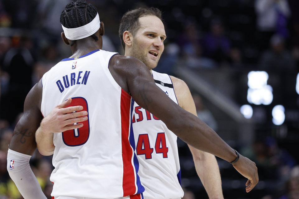 Pistons forward Bojan Bogdanovic and center Jalen Duren congratulate each other after the Pistons' 125-116 win on Wednesday, Nov. 23, 2022, in Salt Lake City.