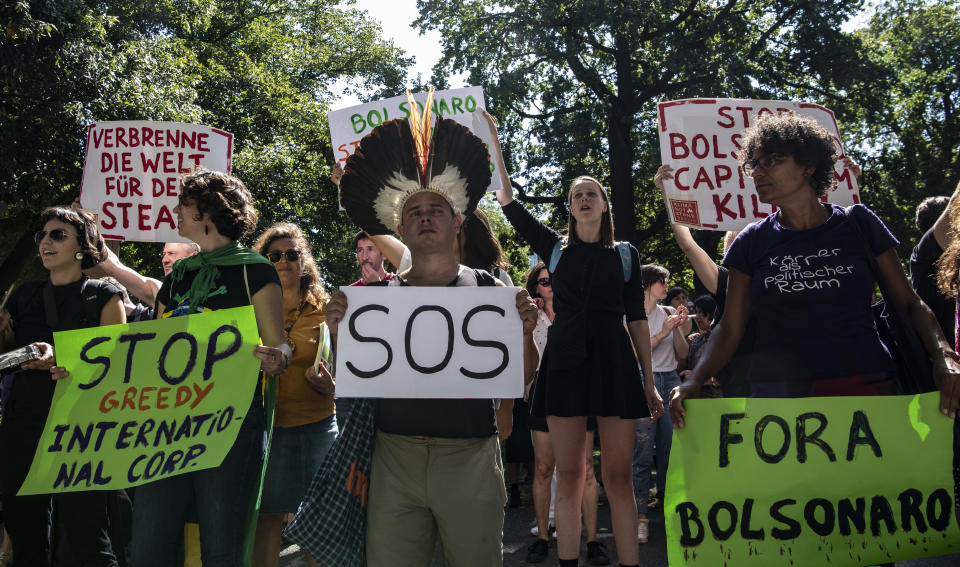 Protestors gather to demonstrate against the Brazilian government and the fires in the Amazon in Berlin, Friday Aug. 23, 2019. (Paul Zinken/Dpa via AP)