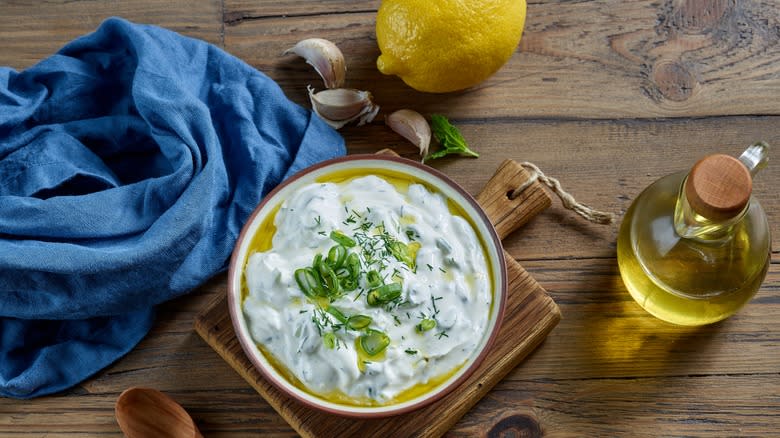 Tzatziki in bowl with ingredients