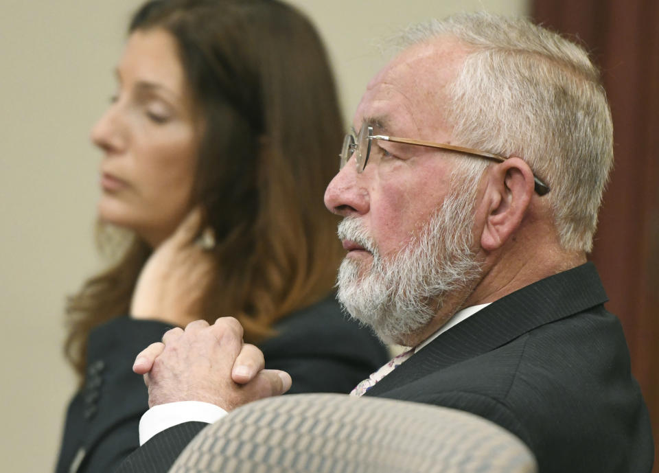 William Strampel, center, the ex-dean of MSU's College of Osteopathic Medicine and former boss of Larry Nassar, appears during closing arguments in his trial before Judge Joyce Draganchuk at Veterans Memorial Courthouse in Lansing, Mich., on Tuesday, June 11, 2019. Strampel is charged with four counts including second-degree criminal sexual conduct, misconduct in office and willful neglect of duty. (J. Scott Park/Jackson Citizen Patriot via AP)
