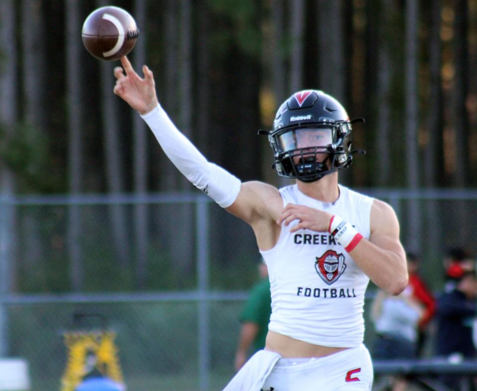 Creekside quarterback Sean Ashenfelder throws in warm-ups before the Oct. 20 game against Fleming Island.