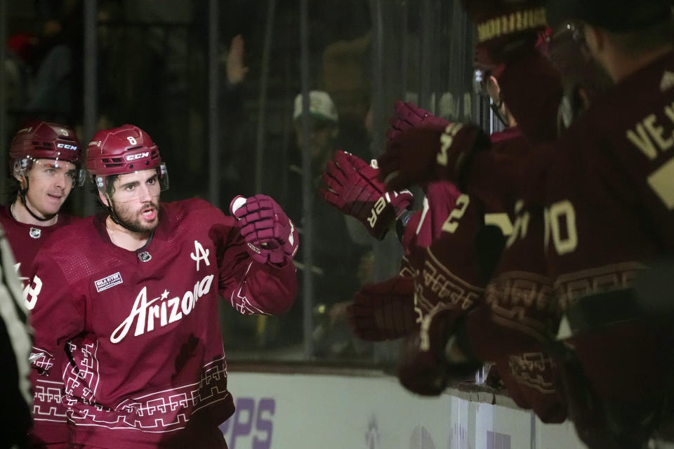 Arizona Coyotes center Nick Schmaltz (8) celebrates his goal against the Colorado Avalanche during the second period of an NHL hockey game Thursday, Nov. 30, 2023, in Tempe, Ariz. (AP Photo/Ross D. Franklin)