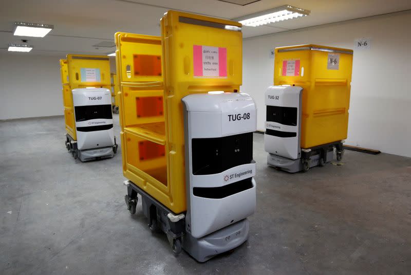 A demonstration of ST Engineering's STrobo Tug robots that distribute food to patients at Changi Exhibition Centre which has been repurposed into a community isolation facility, in Singapore