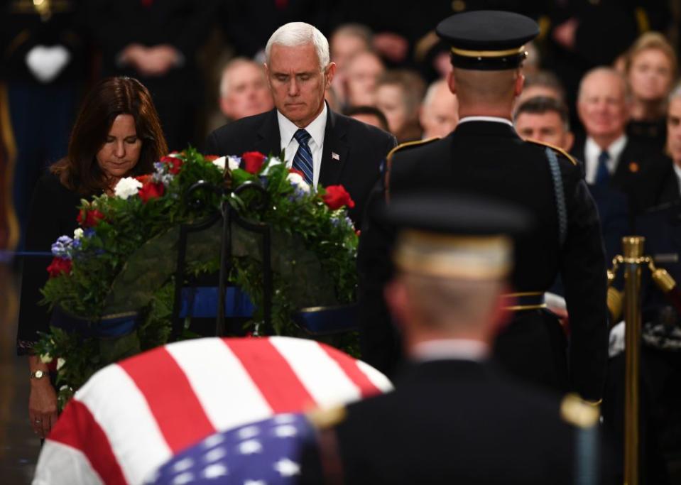 14) Vice President Bush and his wife Karen Pence pay their respects.