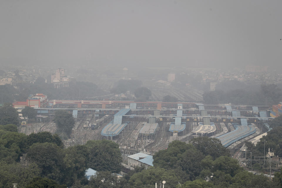 A thin layer of smog envelops a train station in New Delhi, India, Wednesday, Oct. 16, 2019. The Indian capital's air quality levels have plunged to "poor," a day after the government initiated stricter measures to fight chronic air pollution. The state-run Central Pollution Control Board's air quality index for New Delhi stood at 299 on Wednesday, about six times the recommended level. (AP Photo/Altaf Qadri)