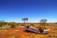 <p>A rolled over junk car rests in the Northern Territory sun.</p>