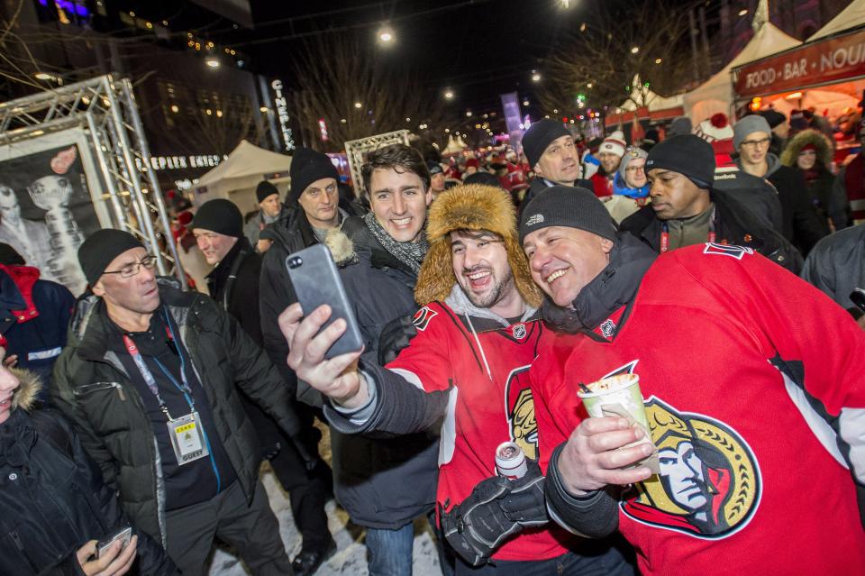 <p>Senators fans brave the cold to pose for a selfie with Prime Minister Justin Trudeau before the action got underway at the NHL 100 Classic Saturday. </p>