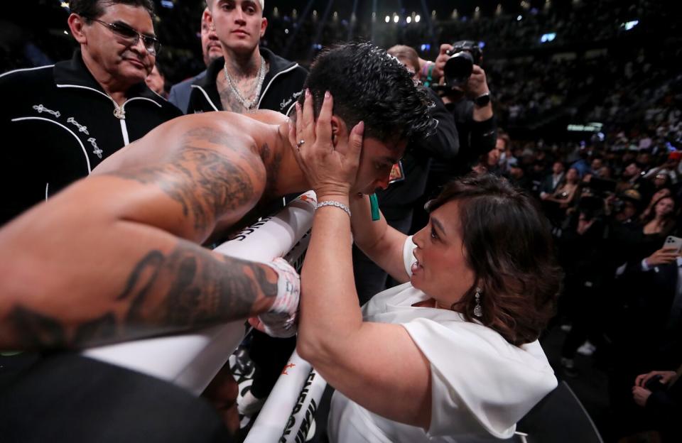 Ryan Garcia is comforted by his mother Lisa after losing by TKO to Gervonta Davis in the seventh round.