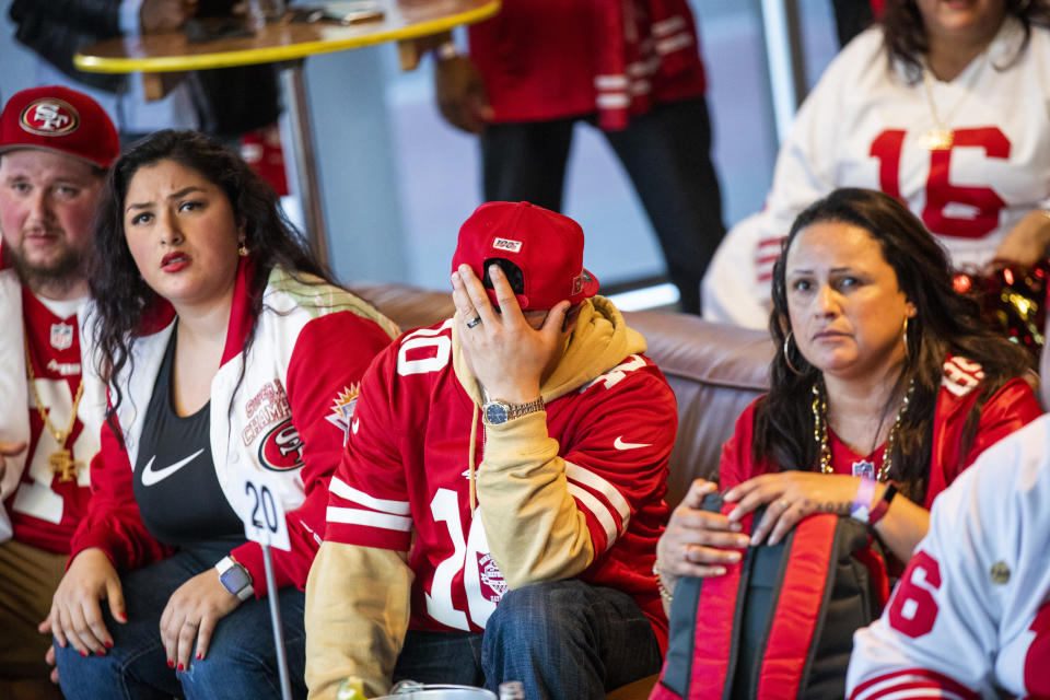 Fans watch the San Francisco 49ers play the Kansas City Chiefs during a Super Bowl LIV watch party at SPIN San Francisco on February 2, 2020 in San Francisco, California. The San Francisco 49ers face the Kansas City Chiefs in Super Bowl LIV for their seventh appearance at the NFL championship, and a potential sixth Super Bowl victory to tie the New England Patriots and Pittsburgh Steelers for the most wins in NFL history. (Photo by Philip Pacheco/Getty Images)