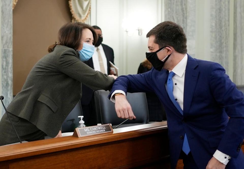 Sen. Maria Cantwell, D-Wash., greets Pete Buttigieg at the Senate Commerce, Science, and Transportation nomination hearings Thursday to consider Buttigieg's nomination to be Secretary of Transportation.