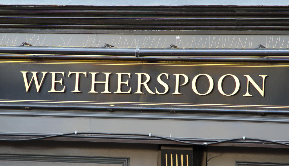 PAIGNTON, DEVON, UNITED KINGDOM - 2019/08/10: A Wetherspoon pub and restaurant logo seen on the high street in Devon. (Photo by Keith Mayhew/SOPA Images/LightRocket via Getty Images)