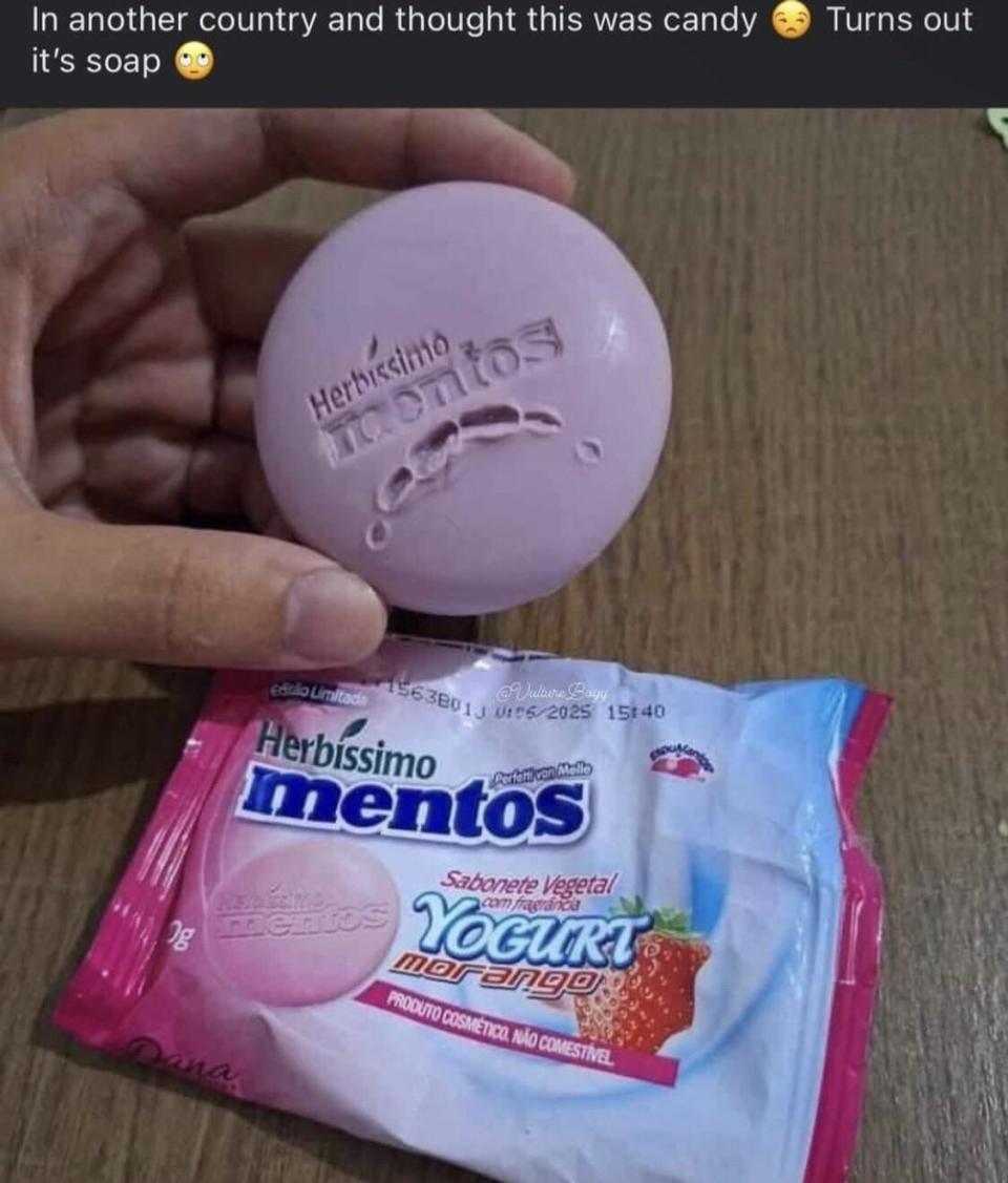 Hand holding a soap labeled "Mentos" above its packaging, mistaken for candy due to familiar branding