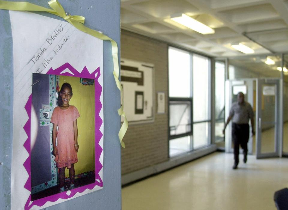 A photo of of Tionda Bradley, 10, hangs in a hallway Wednesday, July 11, 2001, where the Chicago youngster attended summer school.